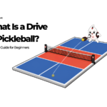 Waypoint mascot hitting a drive from the baseline on a pickleball court